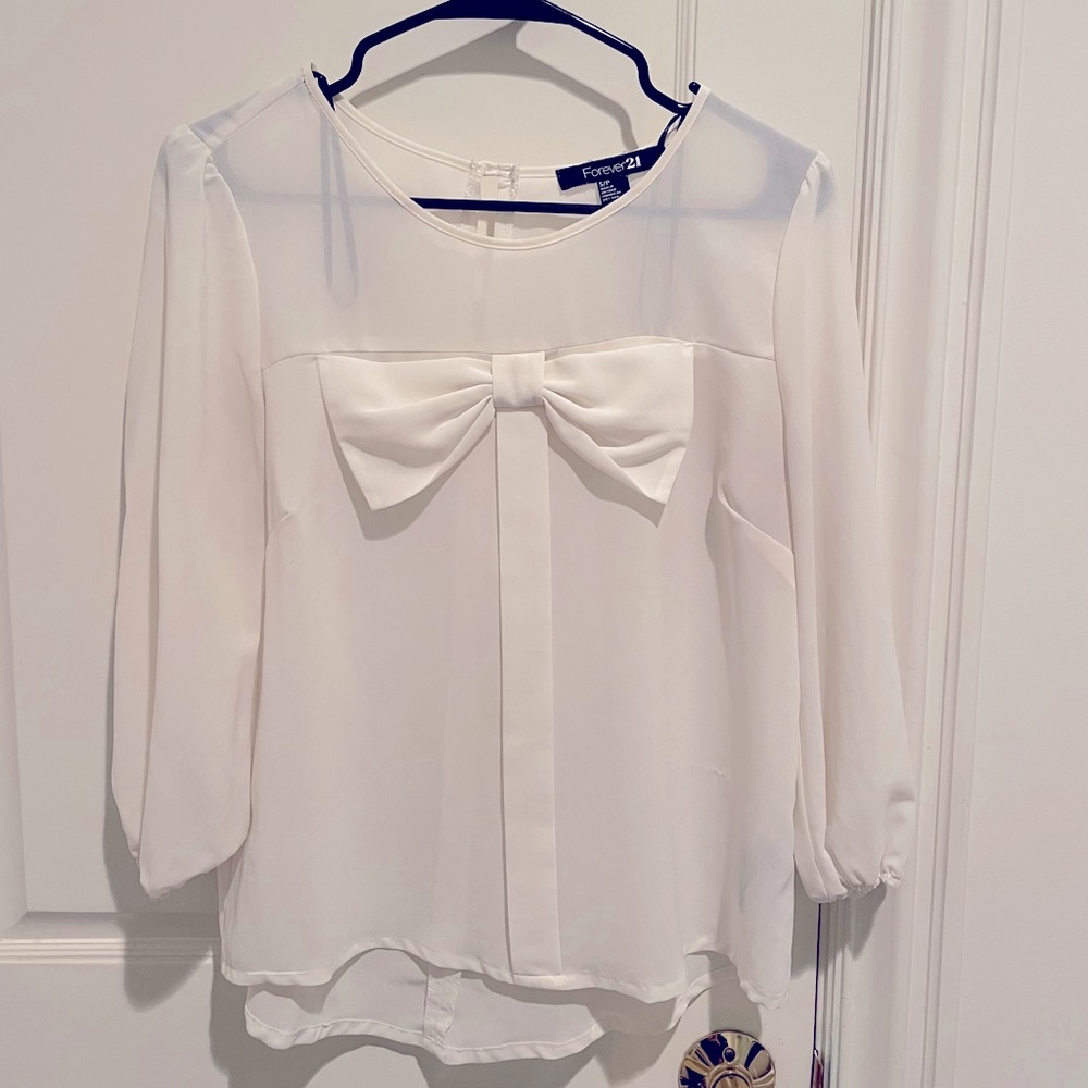Off-white blouse with the now bow